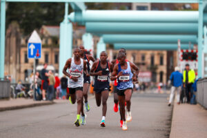 01.10.23 - Principality Building Society Cardiff Half Marathon 2023 - Leaders of the men's race, Shadrack Kimining, Benard Biwott and Vincent Mutai, with Geoffrey Keogh and Wesley Kimutai behind, at the Cardiff Barrage