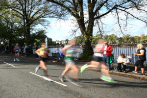 06.10.19 - Cardiff University Cardiff Half Marathon -
Runners pass Roath Park Lake