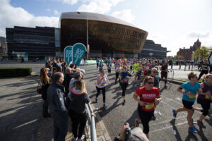 06.10.19 - Cardiff Half Marathon 2019 - Runners make their way through Cardiff Bay, Roald Dahl Plas and past the Wales Millennium Centre at the halfway point of the race
